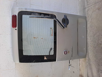PORTA CARICO POST. A BATTENTE SX.